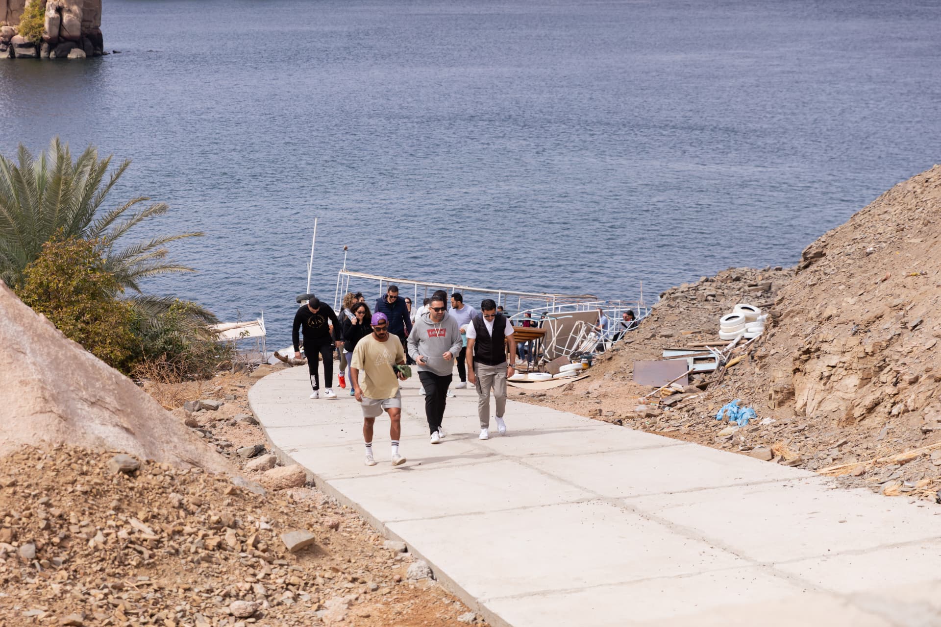 A team walking together along a lakeside path